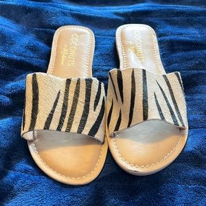 NWOT Ladies zebra print slip on flat sandals, size 10 M.